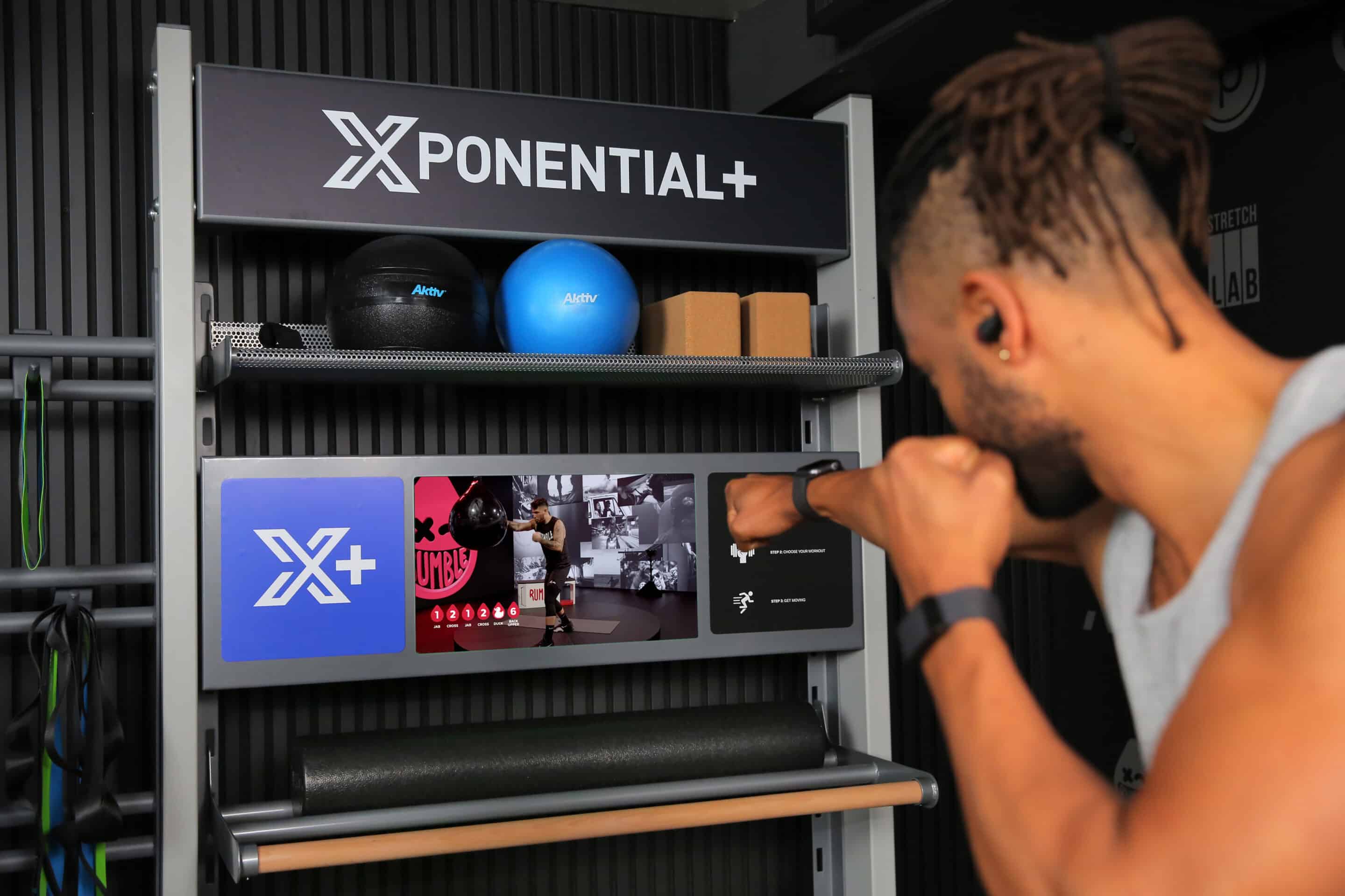 Working out in apartment gym with Xponential+ app.