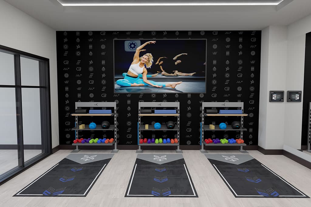 Double Xponential+ Training Bays with digital exercise guidance on the wall and gym flooring.