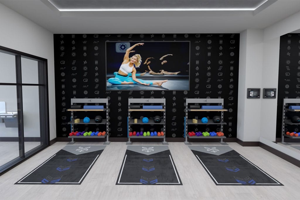 Xponential+ Functional Fitness on gym TV in amenity room with two Gym Rax storage bays and 3 mats.